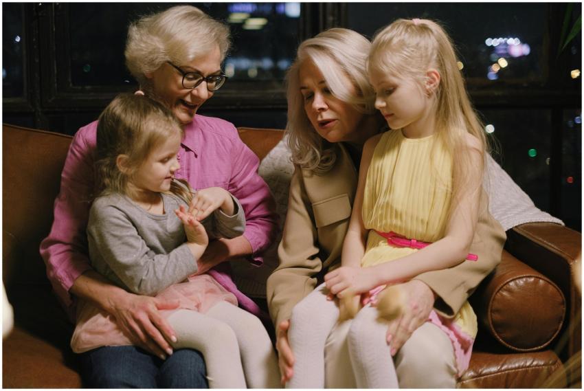 A warm family moment indoors with two grandmothers