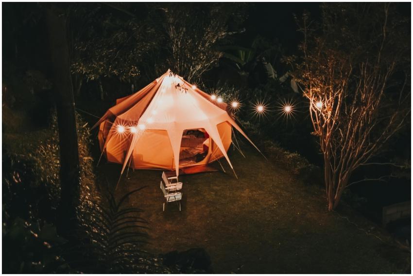Illuminated tent setup for a cozy camping night in