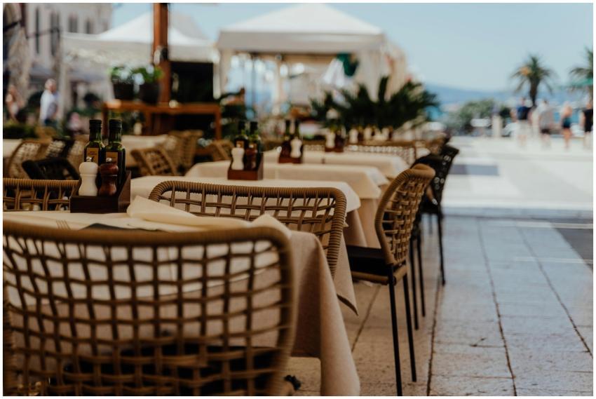 Charming outdoor restaurant with neatly arranged t