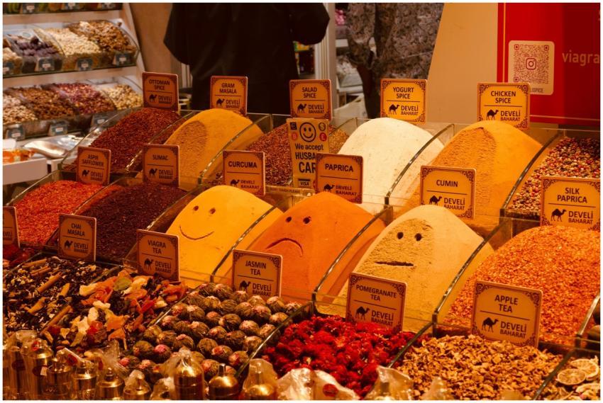 Vibrant spices and teas on display in a bustling m