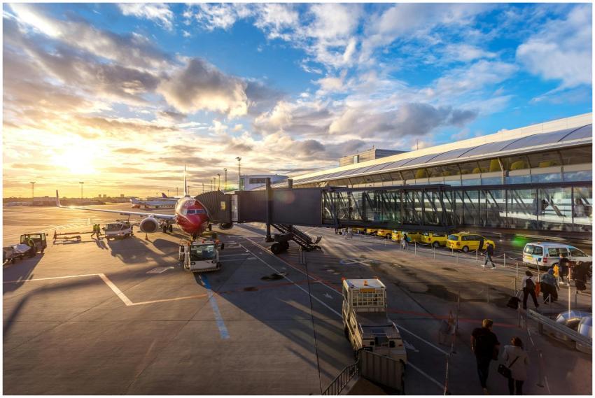 A vibrant sunset at Copenhagen Airport with airpla