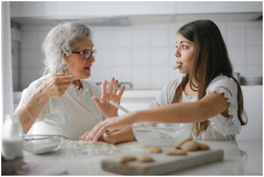 Calm senior woman and teenage girl in casual cloth