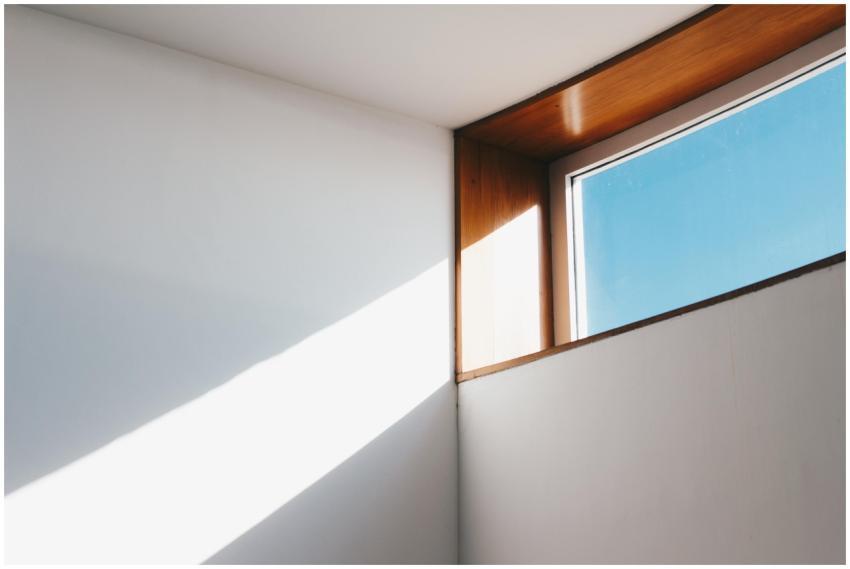 A minimalist interior showcasing sunlight streamin