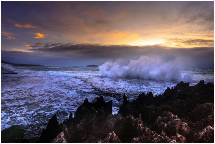 Stunning seascape with waves crashing against rock