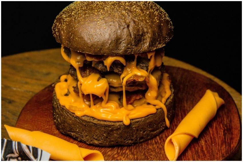 Delicious gourmet burger with melted cheese oozing