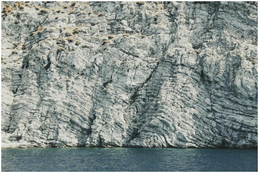 Stunning view of a textured cliff meeting the blue