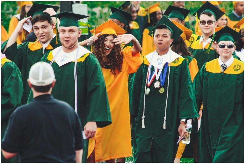 Graduates celebrate with smiles and excitement at