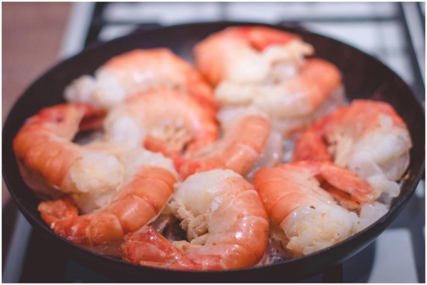 Delicious close-up of prawns sizzling in a frying