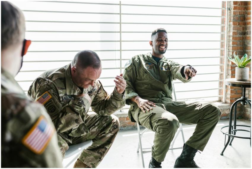 Military veterans laughing together during a suppo