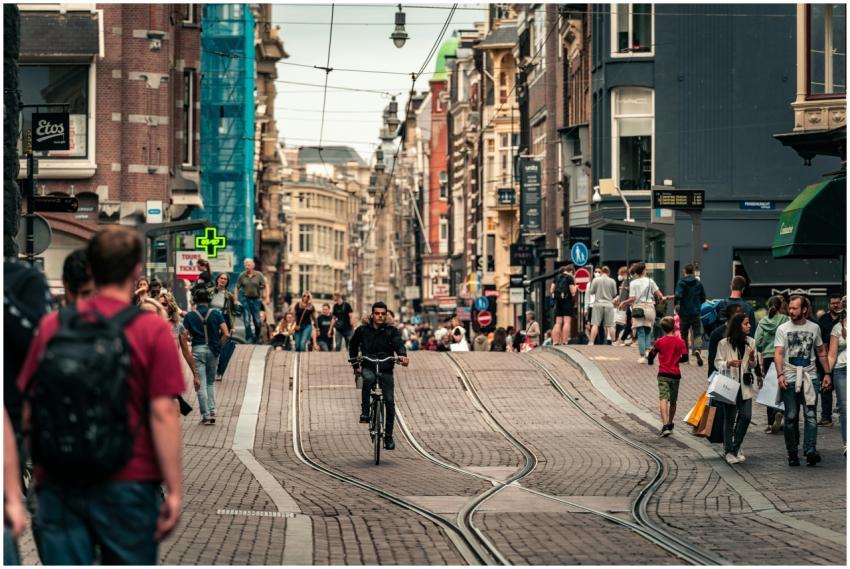 Vibrant Amsterdam street scene with cyclists and p