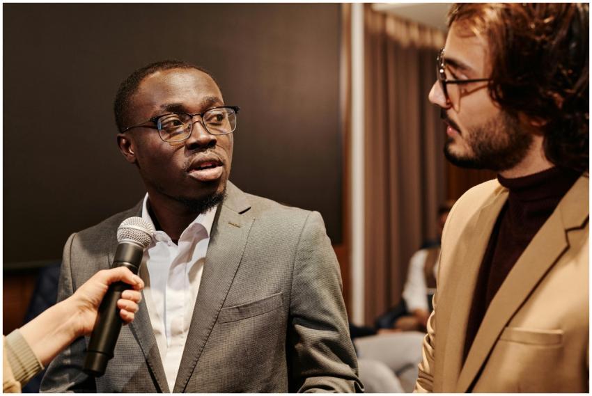 Two business professionals in formal attire having