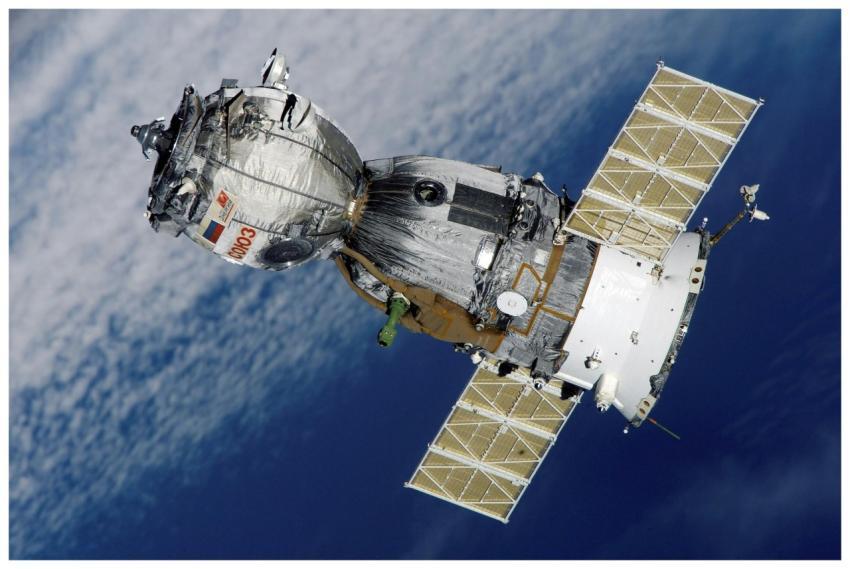 Close-up of Soyuz spacecraft orbiting Earth with s