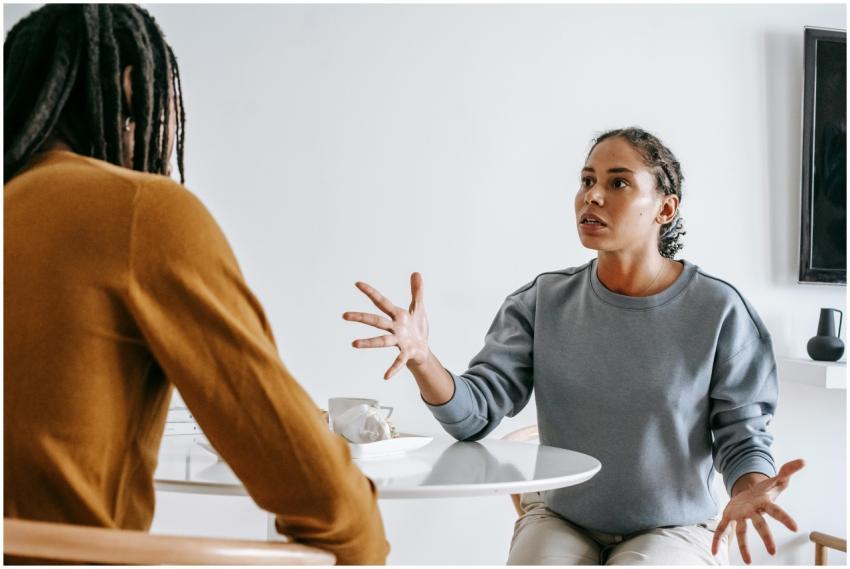 A couple engaged in a serious discussion at a home