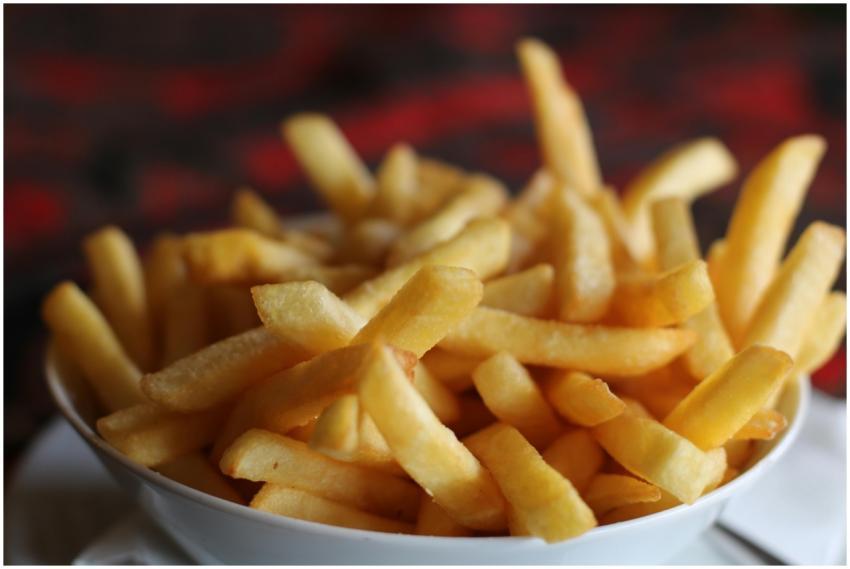 Delicious crispy golden french fries served in a w