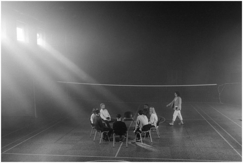 A black and white image of a small group therapy s