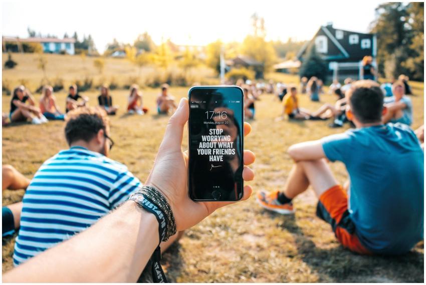 A smartphone with an inspirational message at a fr