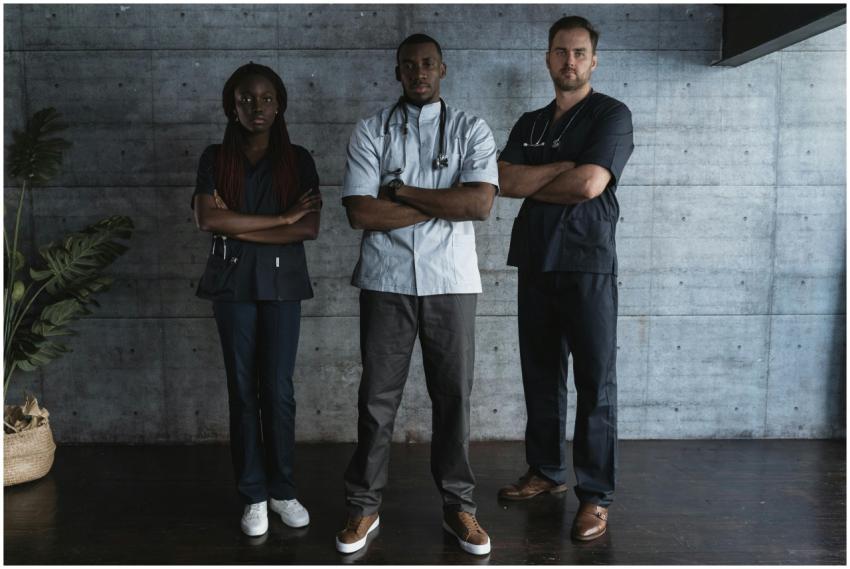 Confident medical professionals standing in hospit