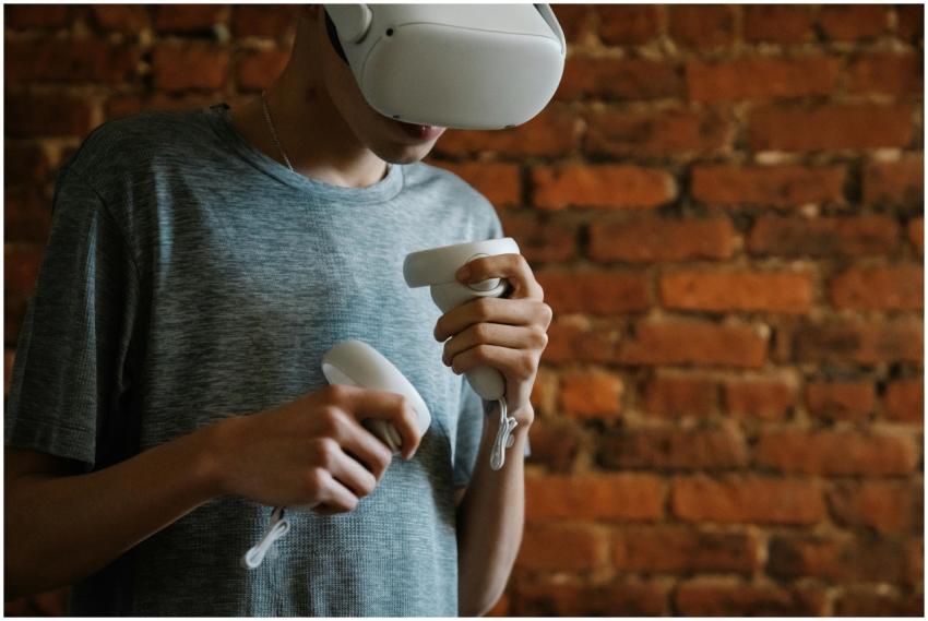 A young man engaging with virtual reality using a