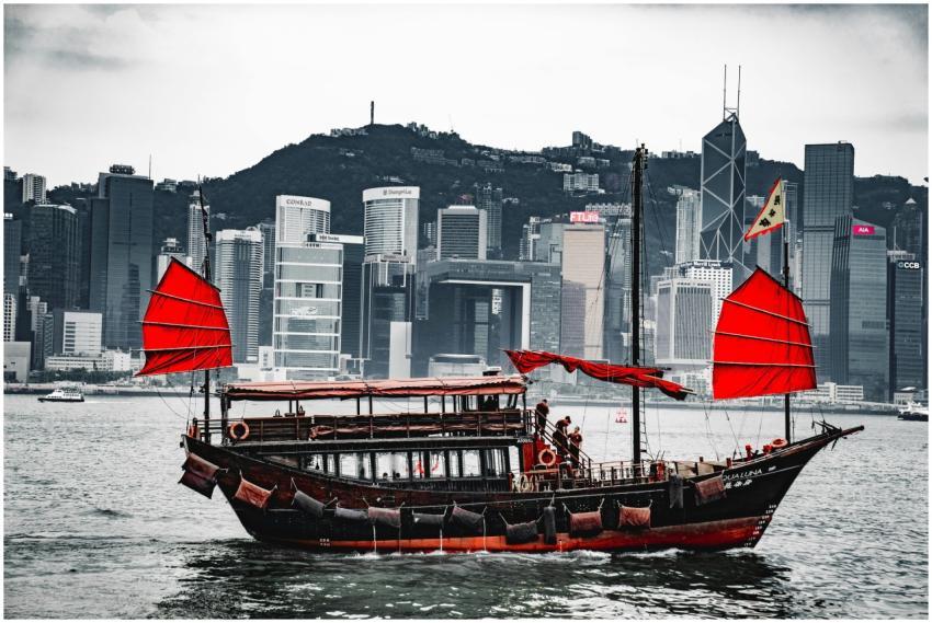 A traditional junk boat with red sails in Hong Kon