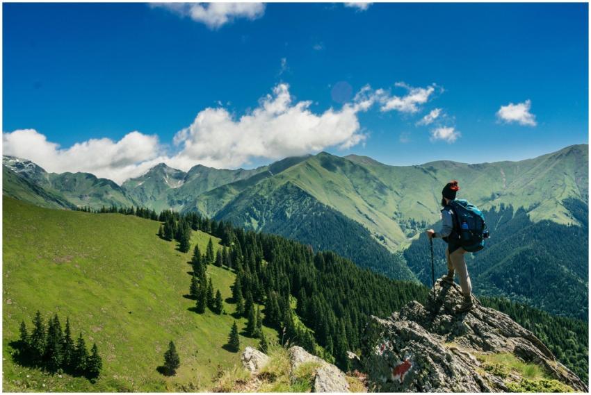 Adventurous hiker enjoying breathtaking views of l
