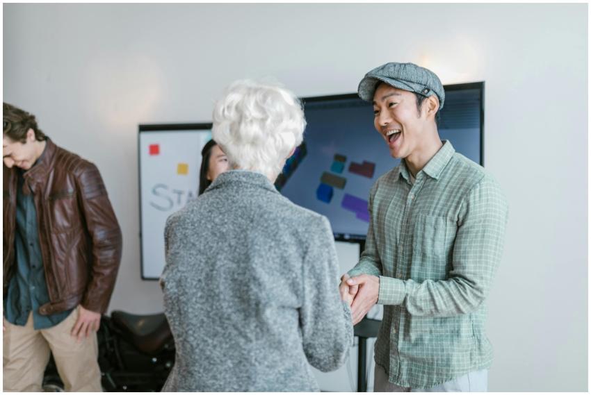 Asian man and elderly woman in a business meeting