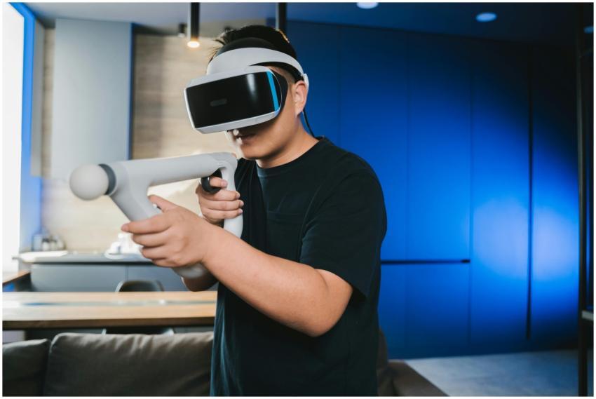 A man using a virtual reality headset and controll