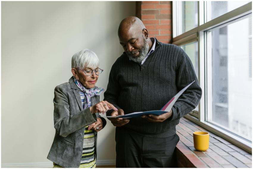 An elderly man and woman engage in a business disc