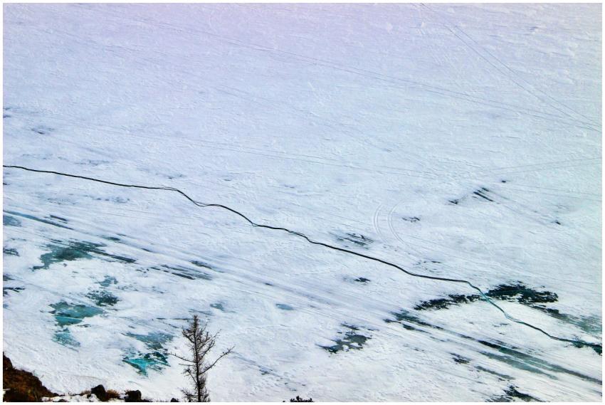 An expansive aerial view of a frozen snowy landsca