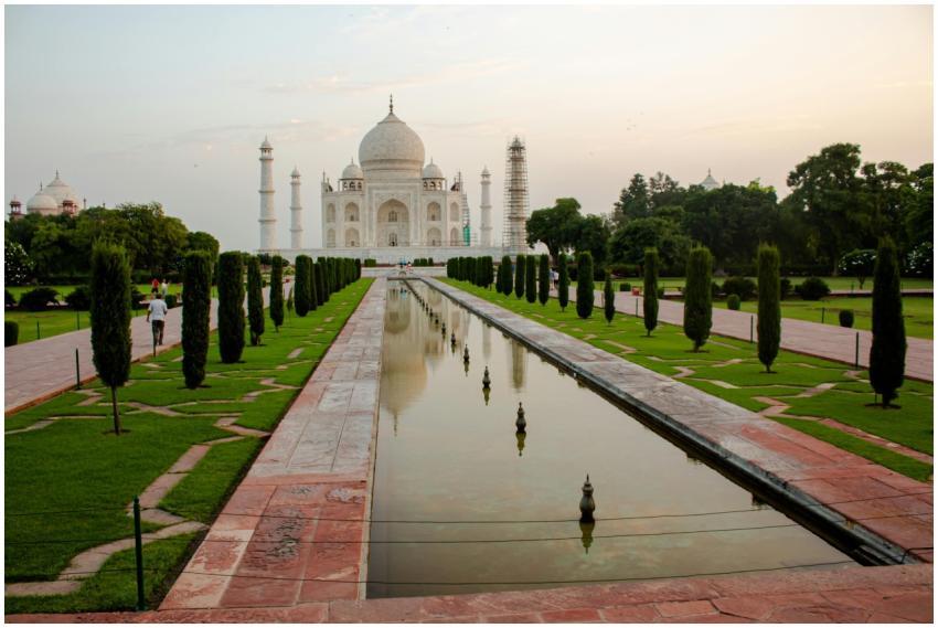 View of the Taj Mahal with reflecting pool at suns