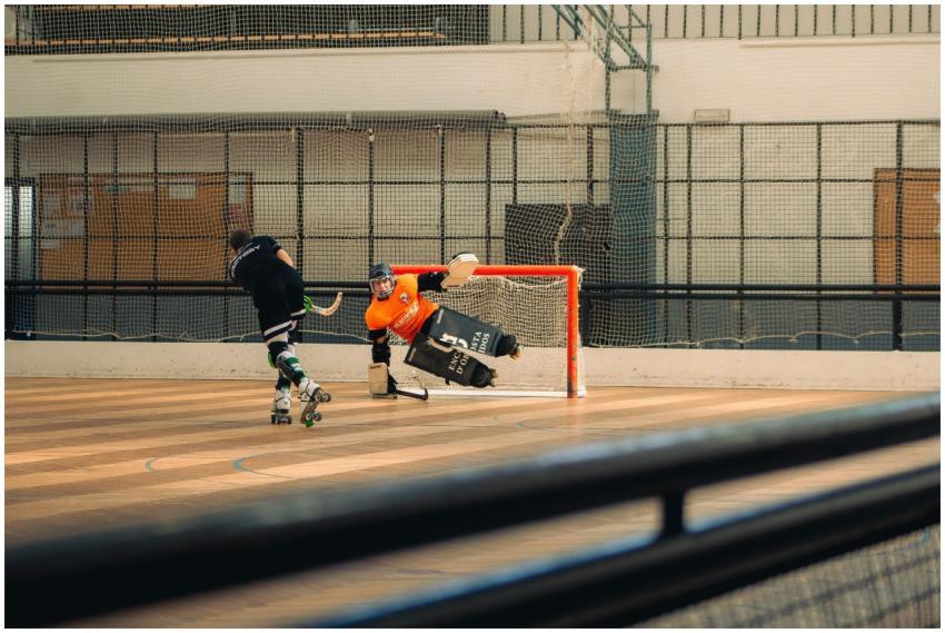 Two players compete in a fast-paced roller hockey