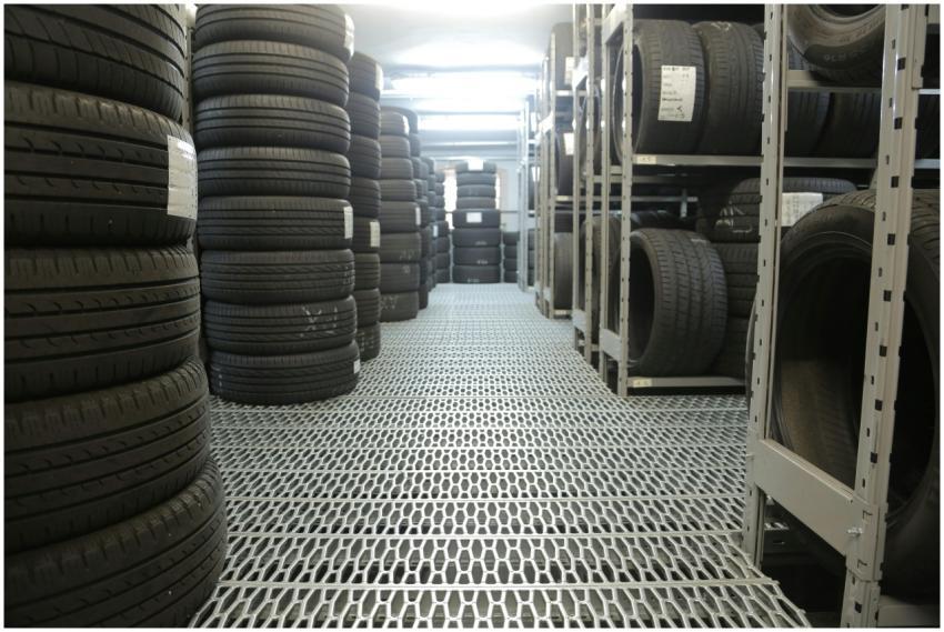 Rows of stacked tires in an indoor industrial ware