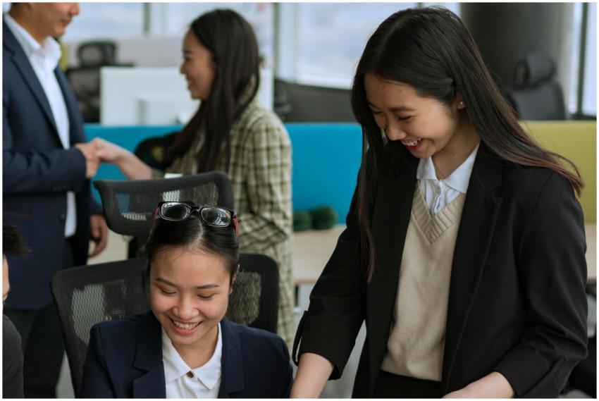 Asian professionals collaborating in a bright mode