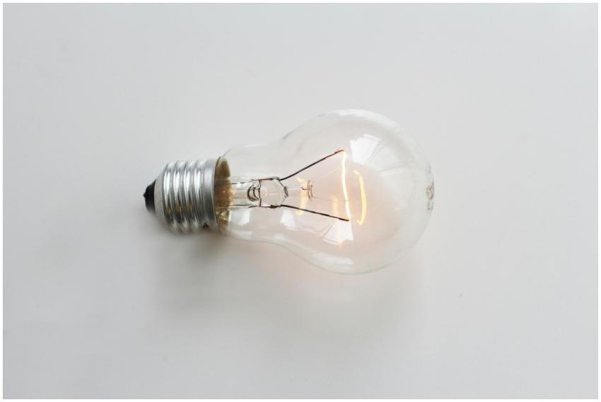 A close-up of an illuminated incandescent light bu