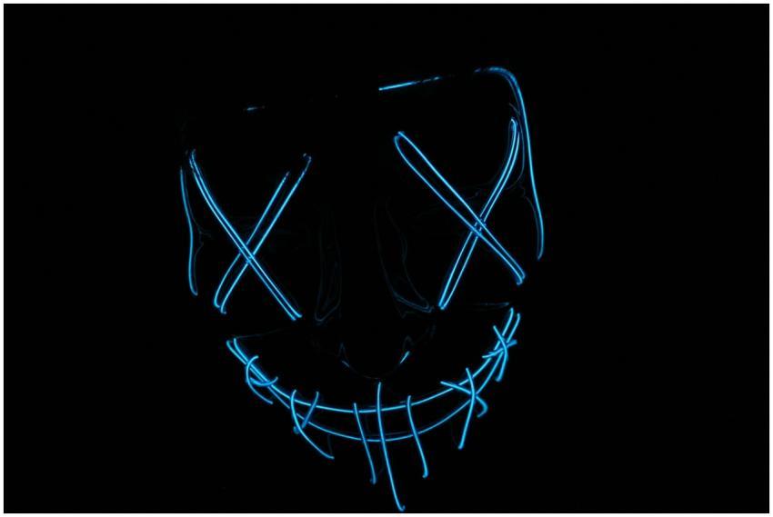Futuristic neon blue LED mask glowing in the dark,