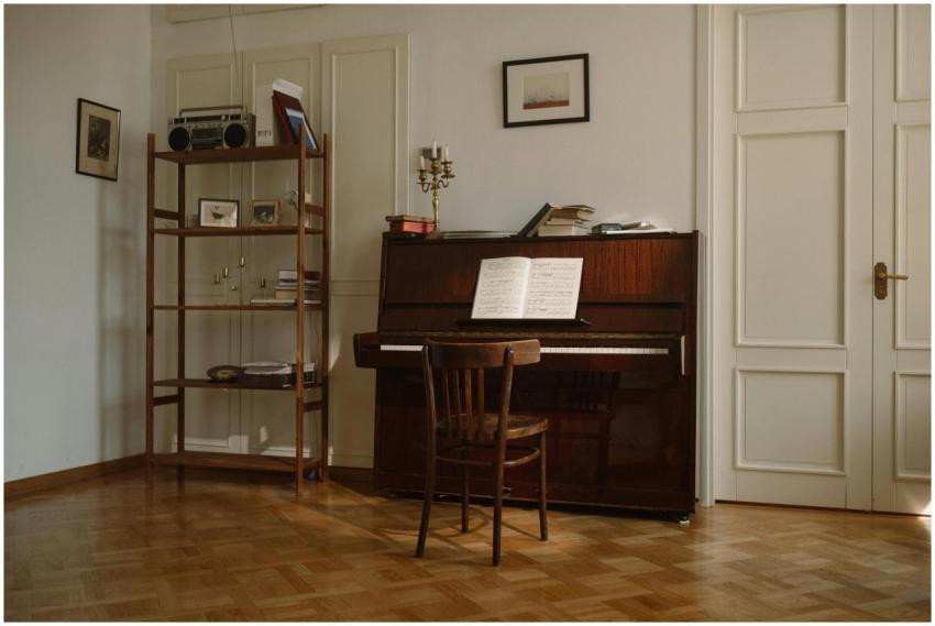 Warm, inviting room with an upright piano, wooden