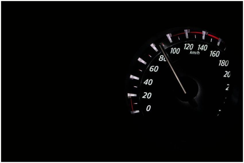 Speedometer reading showing speed in km/h on a dar