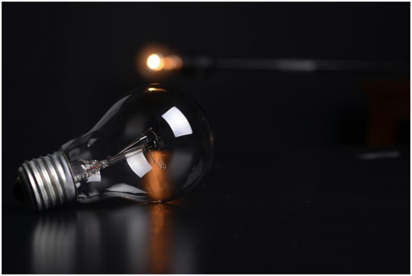 Detailed shot of a reflective light bulb on a dark