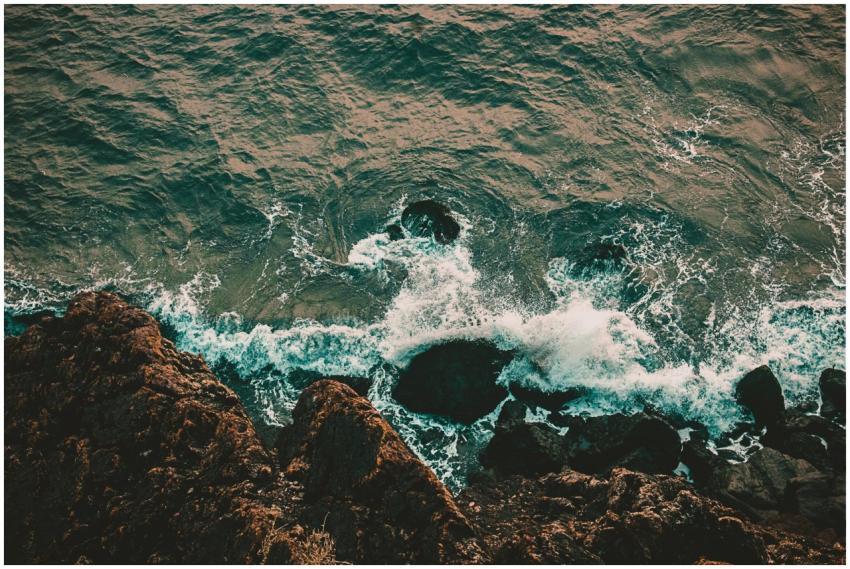 A breathtaking aerial shot of waves crashing on a