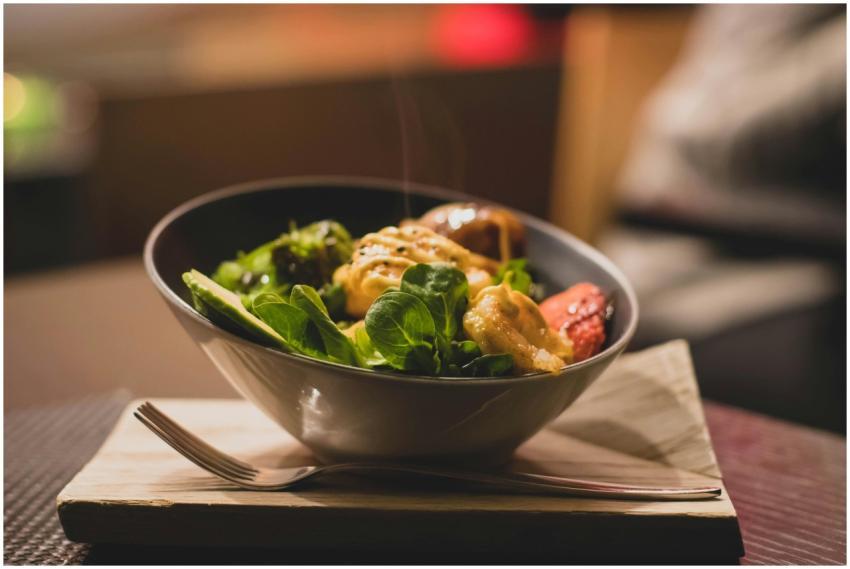 Delicious bowl of salad with fresh greens and gril
