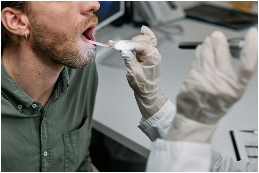 Close-up of a doctor examining a patient's throat