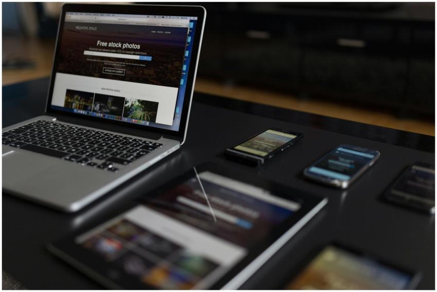 A contemporary workspace showcasing a laptop, tabl