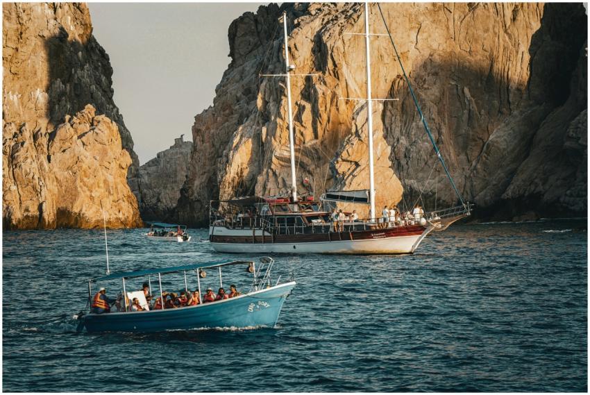 Boats navigate through stunning rocky coastal clif