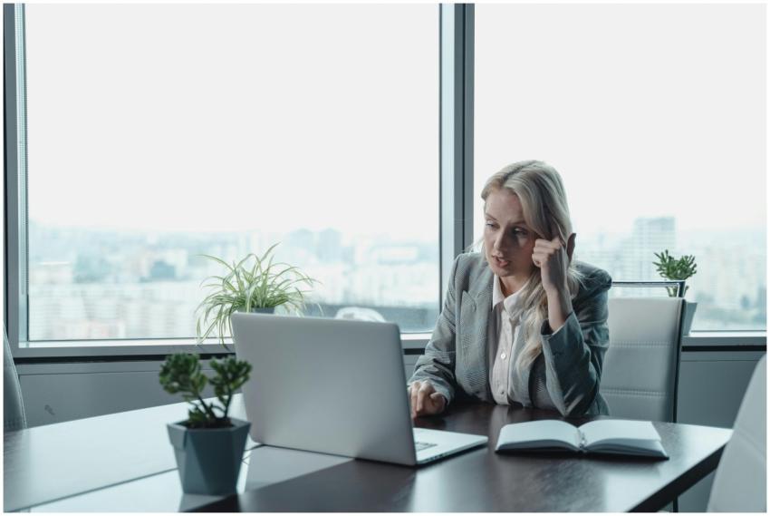 Professional woman engaged in a video meeting at a