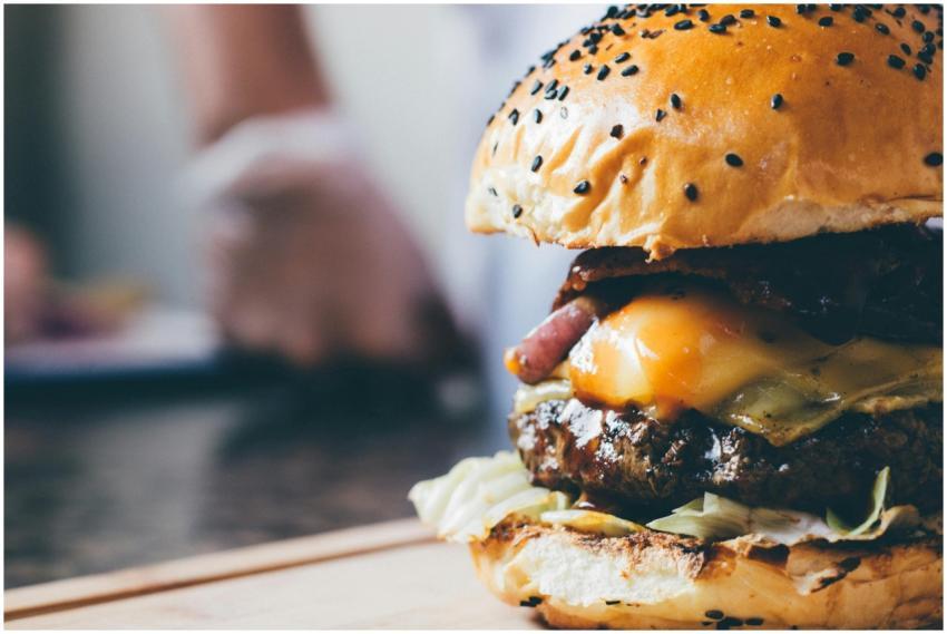 Tasty cheeseburger with juicy beef patty and sesam