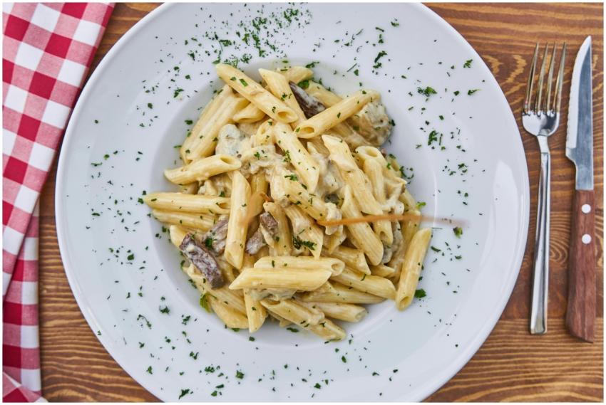 Delicious creamy penne pasta with mushrooms and pa