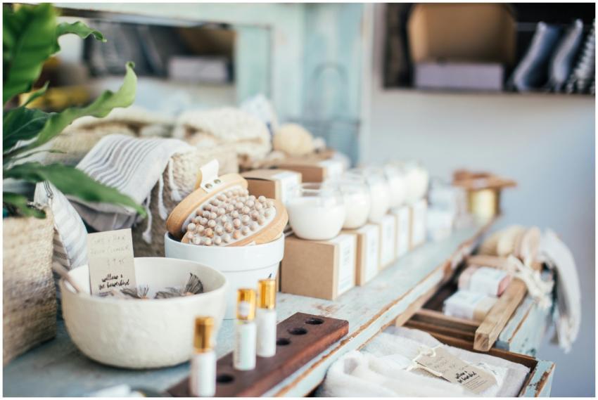Many fragrant candles placed near massage brushes