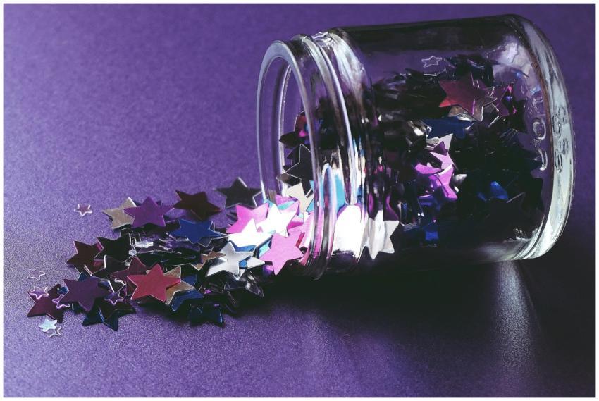 Close-up of colorful star-shaped confetti spilling