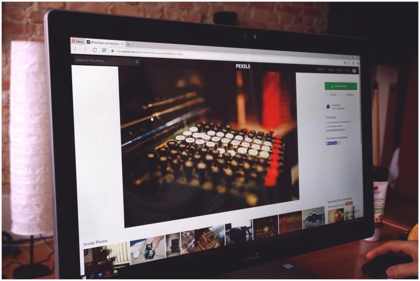 A modern desk setup with a computer monitor displa