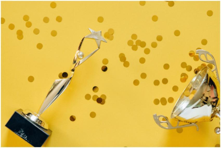 Golden trophy with celebratory confetti on a vibra
