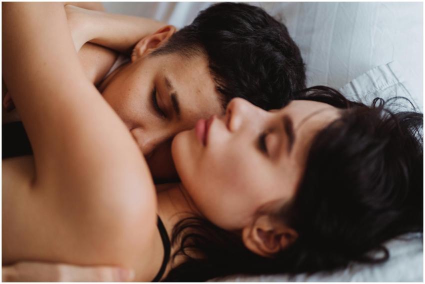 Close-up of a couple embracing while sleeping, sho